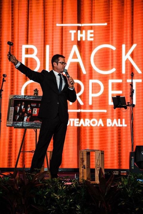 Raising the hammer at The Black Carpet — Aotearoa Ball